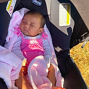 Amelia is registered to the contest to win money with this photo: baby, sleeping, pink_blanket, pink_outfit, car_seat, chicco, infant, child, sunlight, shadow, soft_texture, cozy, resting, cute, newborn, foot, hand, head, portrait, outdoor
