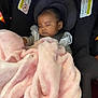baby, sleeping, car_seat, blanket, pink, child, infant, seatbelt, warning_label, soft, cozy, indoors, headrest, clothing, cute, peaceful, face, resting, toddler, comfort