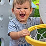 toddler, child, smiling, happy, outdoor, basketball_hoop, playground, toy, plastic, grass, greenery, short_sleeve_shirt, scratches, face, person, play, daylight, casual_clothing, hand, young