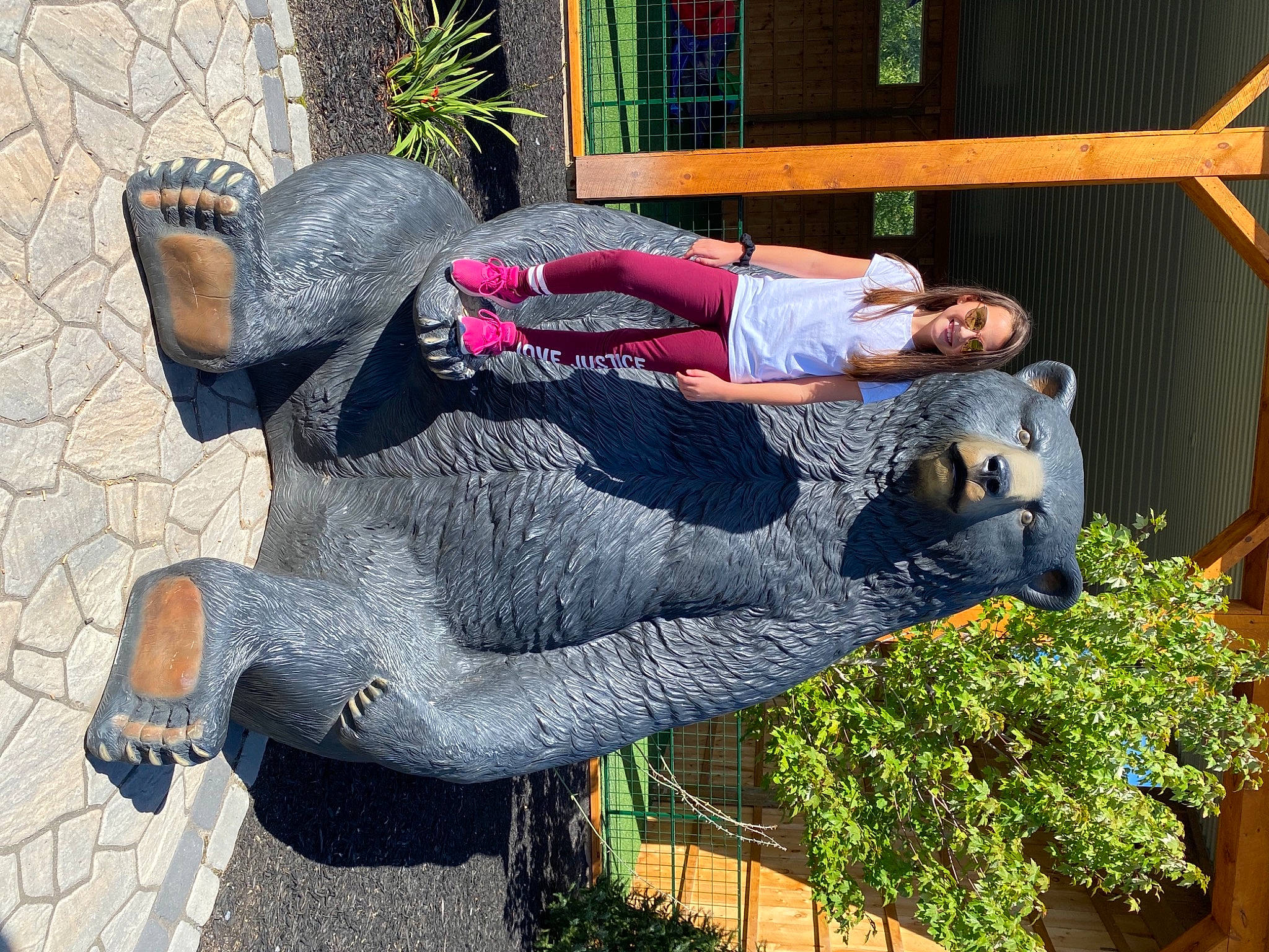 Harmonie is registered to the contest to win money with this photo: annual_plant, art, cobblestone, fun, garden, grass, houseplant, joy, landscaping, lawn_ornament, leisure, person, plant, shrub, sitting, smile, tree, yard