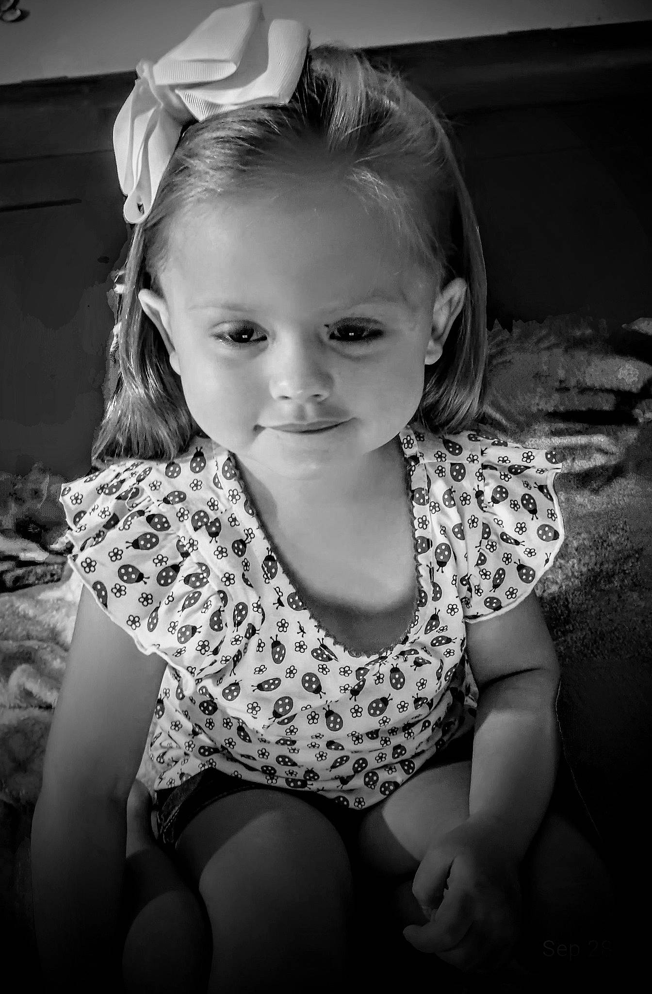 Abigail is registered to the contest to win money with this photo: arm, black_and_white, child, clothing, cool, flash_photography, fun, hair, hairstyle, happy, iris, leg, monochrome, monochrome_photography, person, shoulder, smile, standing, style, toddler