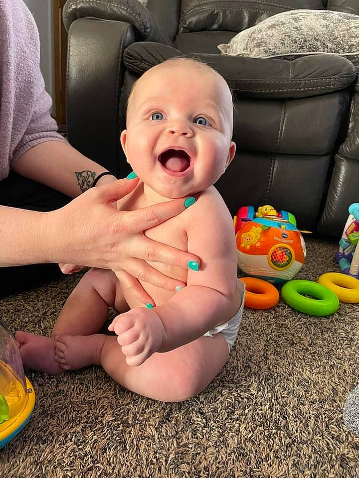 Aubree joined the competition — help win amazing prizes! arm, baby, baby_toddler_clothing, chair, child, comfort, finger, foot, fun, gesture, happy, leg, mouth, nail, person, smile, textile, thigh, thumb, toddler