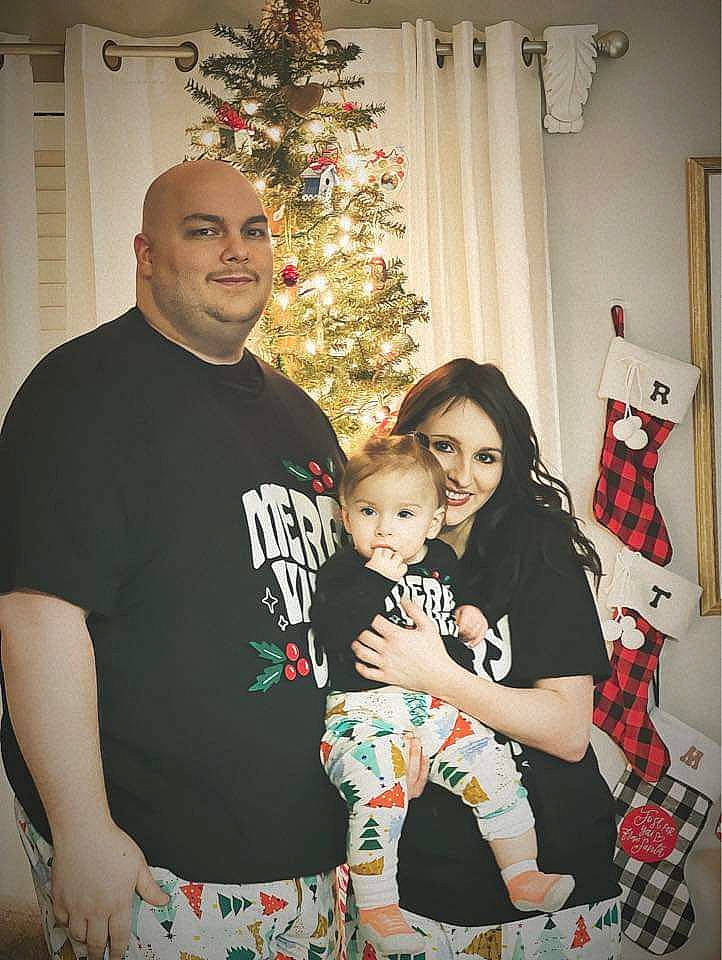 Malia joined the competition — help win amazing prizes! baby, child, christmas_ornament, christmas_tree, event, facial_expression, fun, hairstyle, happy, holiday, holiday_ornament, joy, lap, people, person, sleeve, smile, standing, t_shirt, toddler