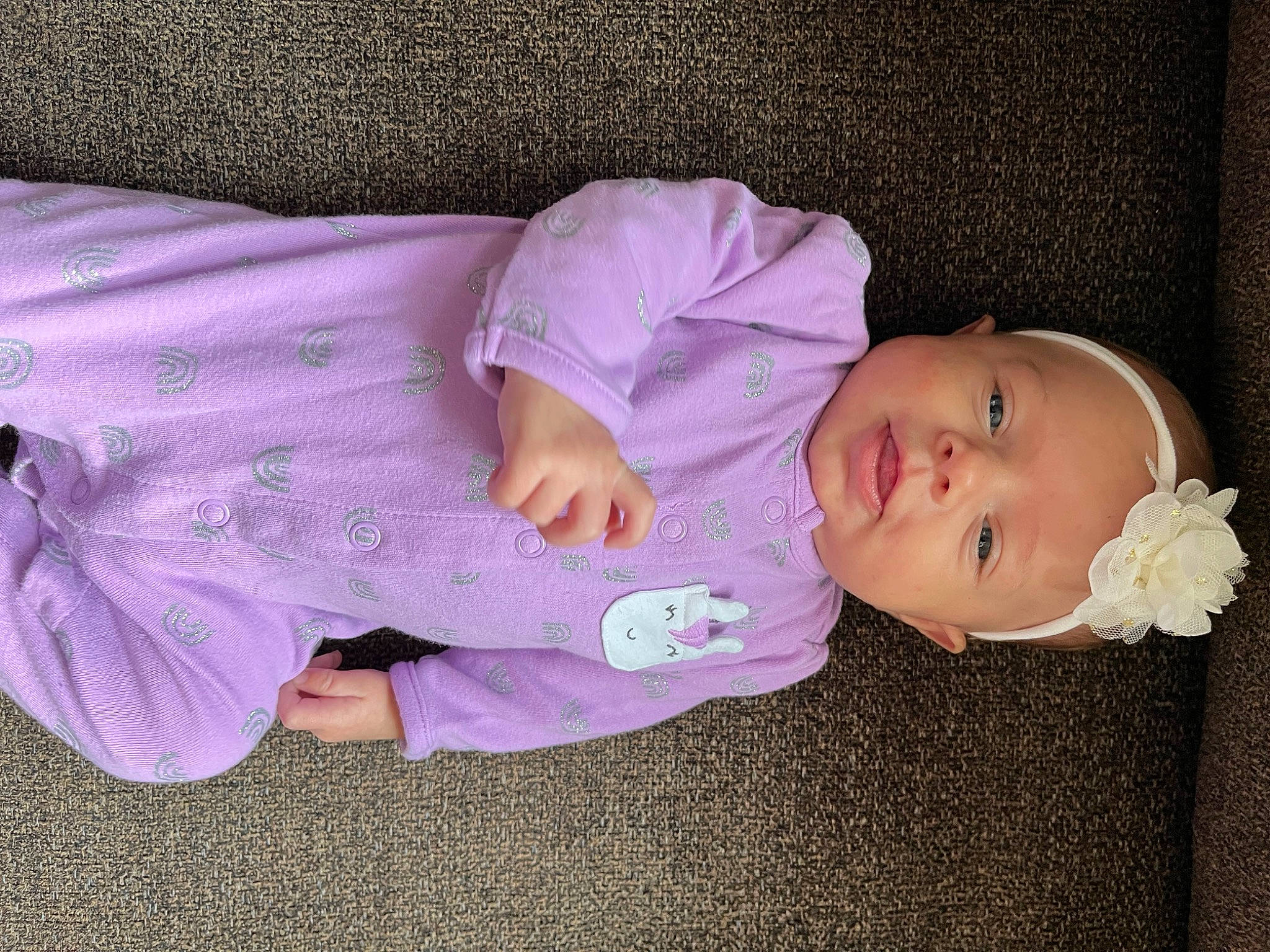 Kynlee is registered to the contest to win money with this photo: baby, baby_products, baby_toddler_clothing, cheek, child, clothing, comfort, magenta, pattern, person, pink, purple, sitting, sleep, sleeve, toddler