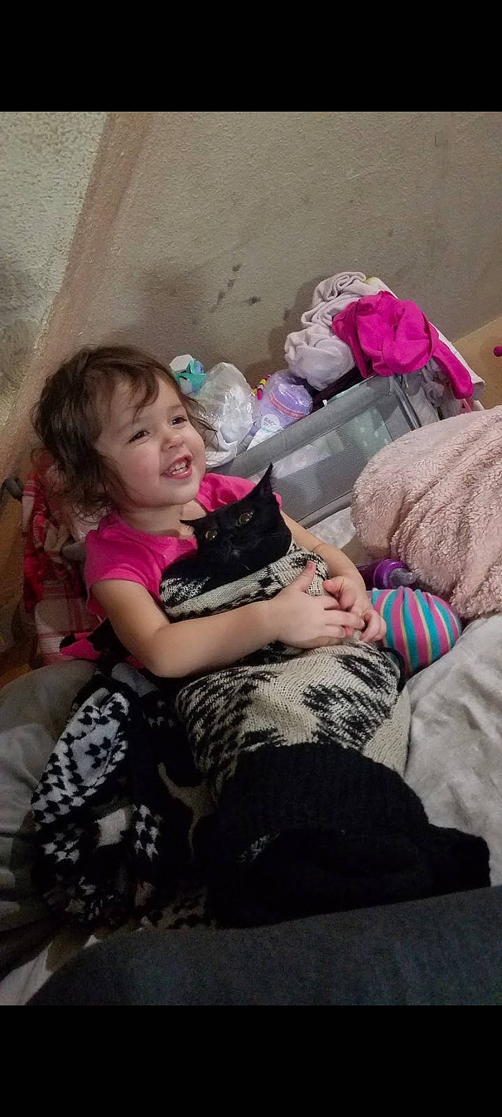 Viviana joined the competition — help win amazing prizes! cat, child, comfort, felidae, finger, fun, happy, human_leg, lap, leg, leisure, magenta, person, pink, purple, sitting, skin, small_to_medium_sized_cats, smile, thigh