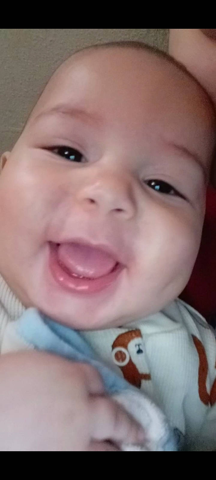 Tysen is registered to the contest to win money with this photo: baby, baby_toddler_clothing, cheek, chin, eyebrow, eyelash, facial_expression, finger, happy, iris, jaw, lip, mouth, neck, nose, person, pink, skin, smile, toddler