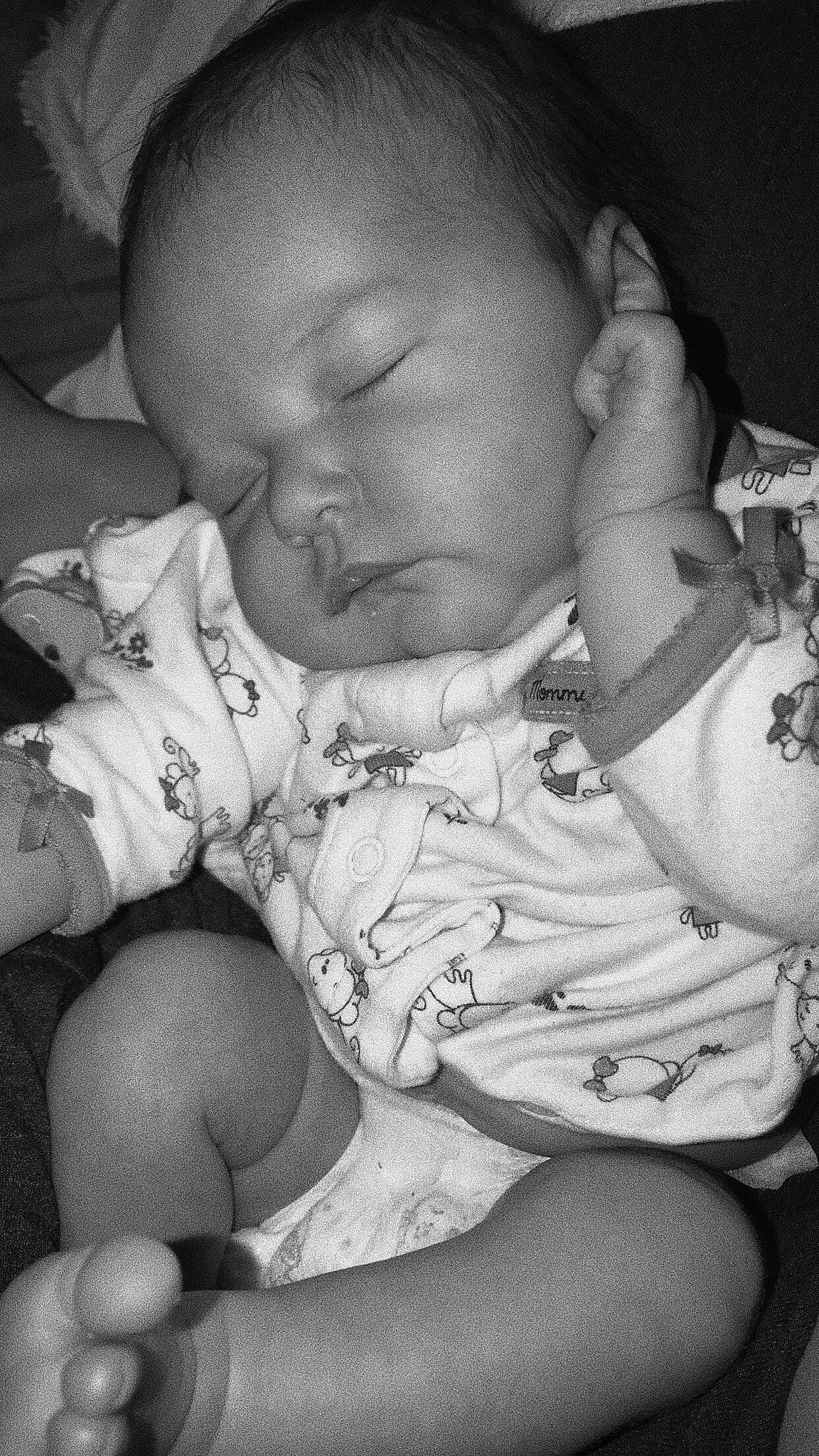 Miyah is registered to the contest to win money with this photo: baby, birth, black, black_and_white, cheek, child, eye, finger, gesture, hand, lip, monochrome, monochrome_photography, mouth, person, photography, skin, sleep, smile, toddler