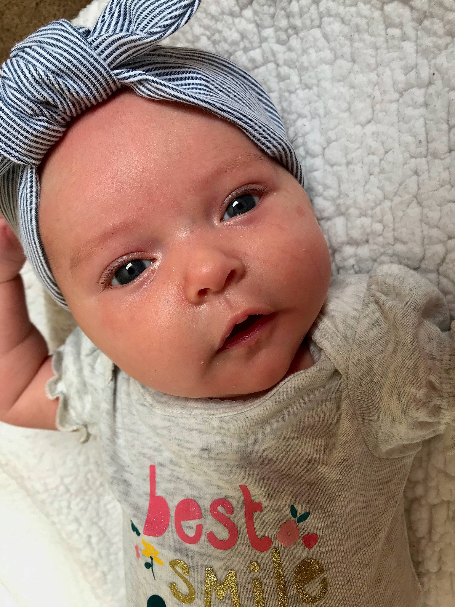 Miyah is registered to the contest to win money with this photo: baby, bonnet, cheek, child, chin, close_up, eye, eyebrow, eyelash, face, forehead, hair_accessory, head, headgear, lip, nose, person, skin, smile, toddler