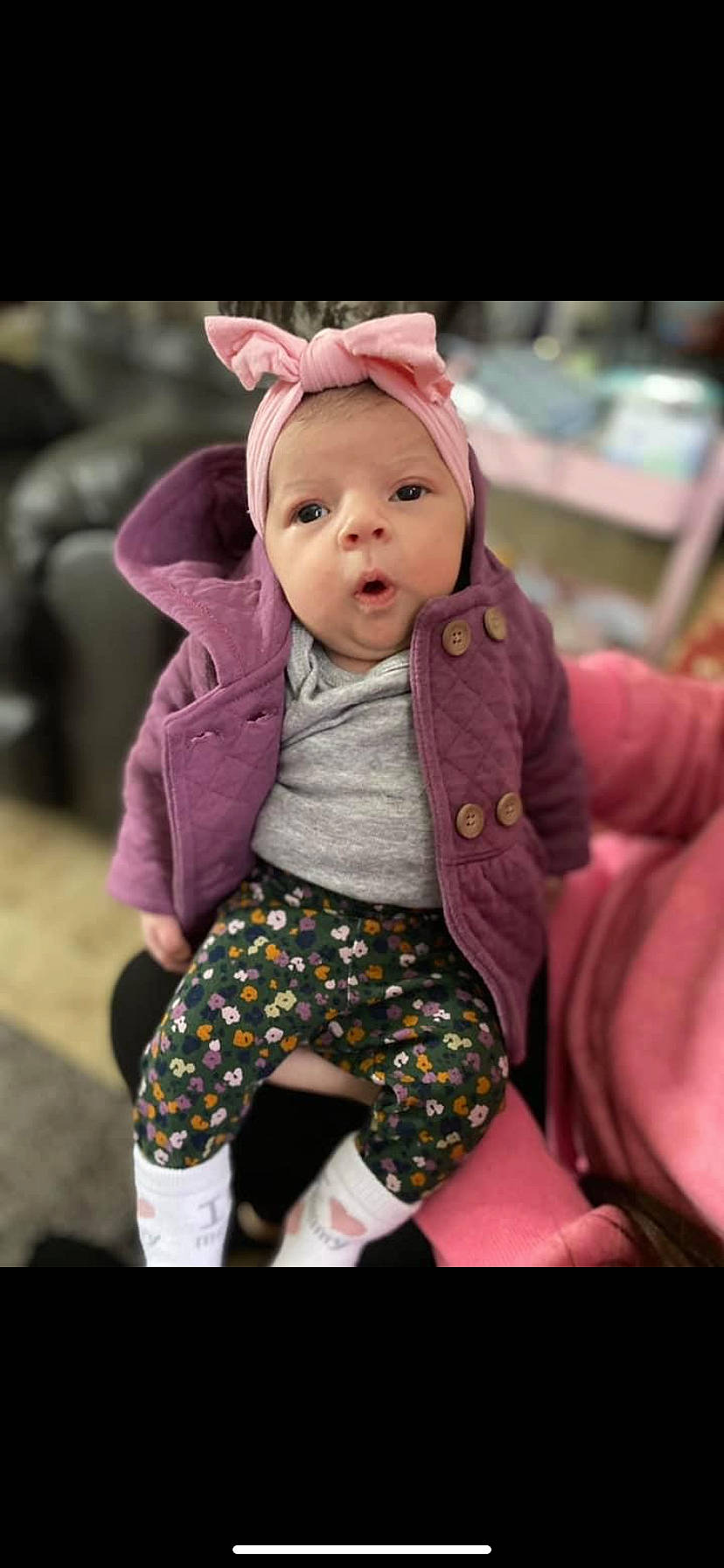 Avler is registered to the contest to win money with this photo: baby, baby_toddler_clothing, cap, cheek, child, doll, eye, fashion_accessory, fur, happy, human_body, magenta, pattern, person, pink, purple, skin, sleeve, toddler, toy