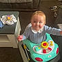 Jaxon is registered to the contest to win money with this photo: baby, baby_walker, blue_sweater, carpet, child, clothing, cute, furniture, happy, home, indoor, living_room, person, pink_toy, play, shoes, smiling, sofa, table, toy