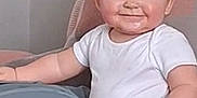 Jaxon is registered to the contest to win money with this photo: adult, arm, baby, blue_shorts, child, couch, cozy, face, furniture, hair, hand, happy, home, indoor, person, portrait, relaxing, skin, smile, white_shirt