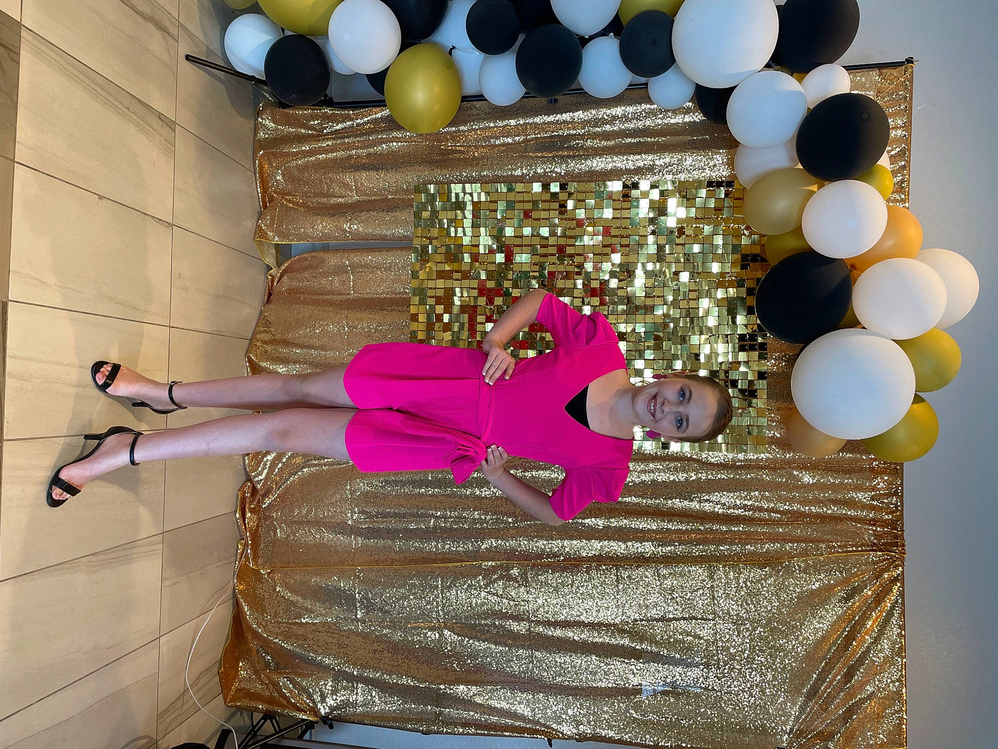 Mckinzy is registered to the contest to win money with this photo: balloon, ceiling, cocktail_dress, decoration, event, fashion, flooring, fun, human_leg, joy, magenta, party_supply, pattern, peach, person, pink, purple, room, textile, thigh