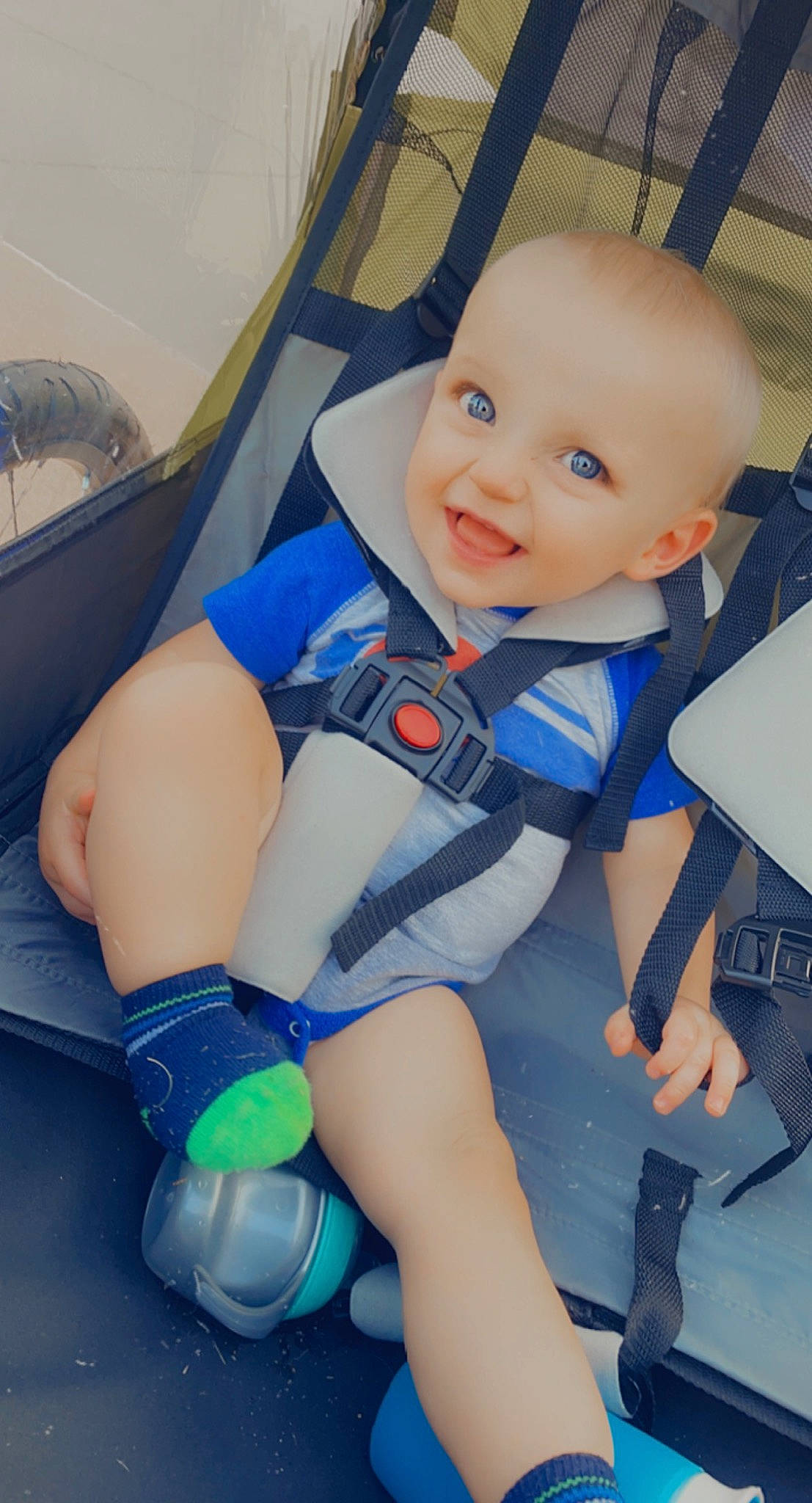 Barrett is registered to the contest to win money with this photo: baby, baby_carriage, baby_toddler_clothing, blue, car_seat, comfort, electric_blue, face, finger, fun, happy, human_body, joy, knee, leg, leisure, mouth, person, skin, smile