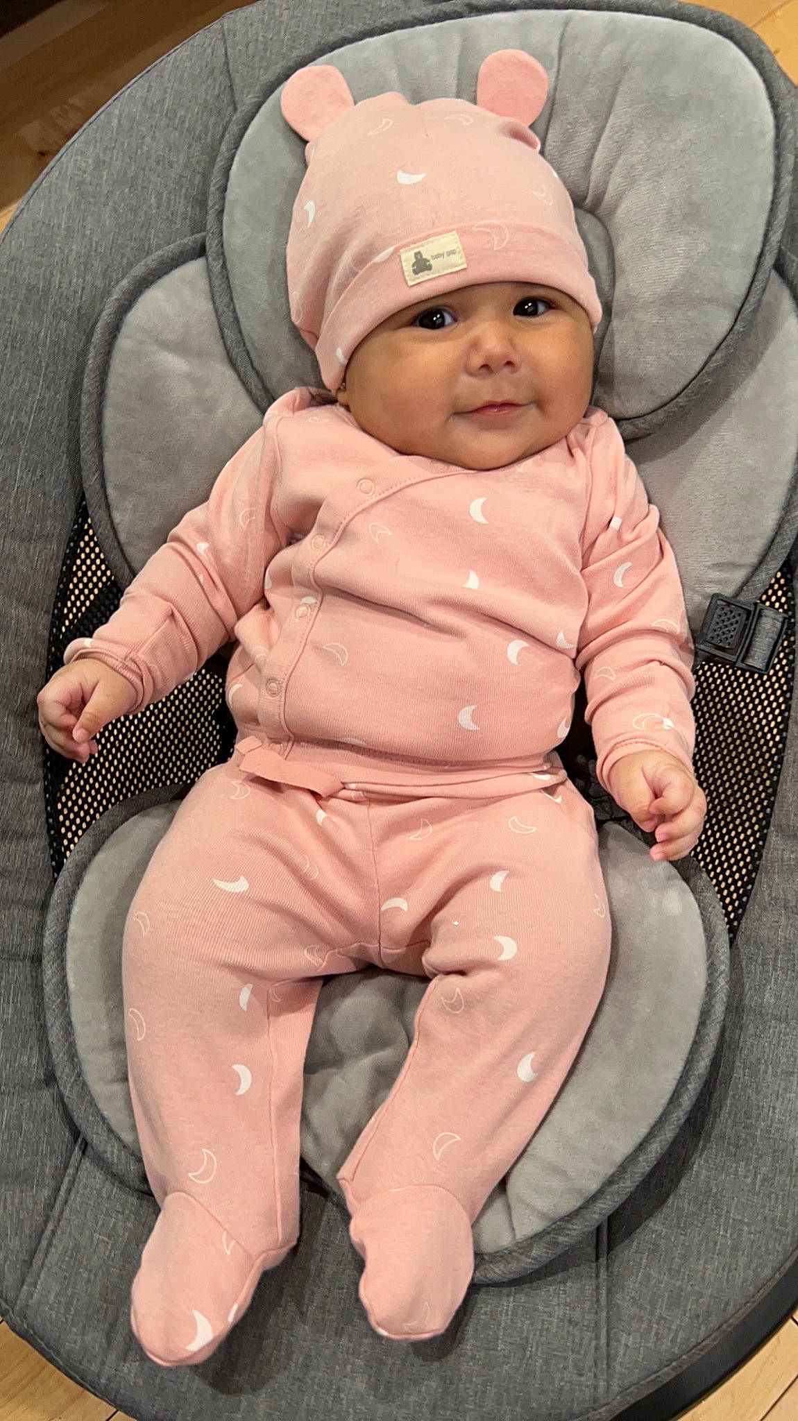Reina joined the competition — help win amazing prizes! baby, baby_products, baby_toddler_clothing, baseball_cap, cap, cheek, child, comfort, facial_expression, fashion_accessory, headwear, knee, linens, outerwear, person, personal_protective_equipment, product, sitting, skin, sleeve