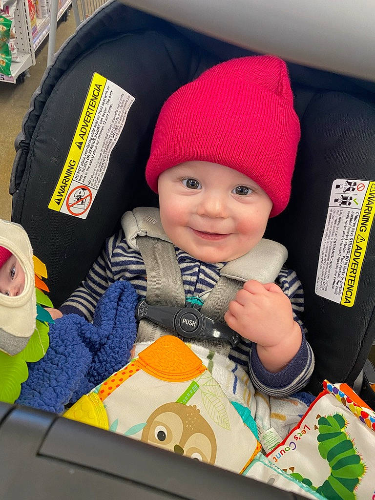 Jayden is registered to the contest to win money with this photo: baby, baby_carriage, baby_products, baby_toddler_clothing, bag, beanie, cap, car_seat, child, fun, happy, headgear, headwear, joy, knit_cap, person, play, sitting, sleeve, smile