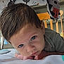 Hunter joined the competition — help win amazing prizes! baby, infant, child, face, blue_eyes, hair, crib, toy, nursery, tummy_time, close_up, expression, curious, indoor, person, cute, striped_clothing, skin, head, lying_down