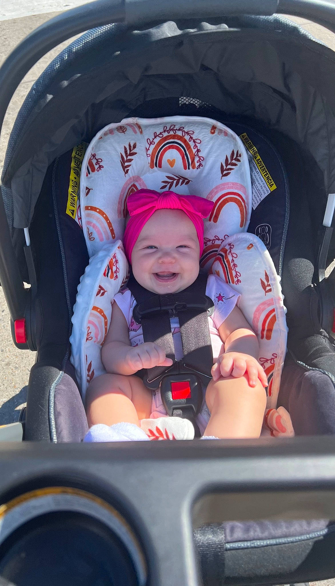 Millie is registered to the contest to win money with this photo: auto_part, automotive_design, baby, baby_products, baby_toddler_clothing, car_seat, child, comfort, fun, happy, headwear, mode_of_transport, motor_vehicle, person, personal_protective_equipment, product, recreation, sitting, toddler, travel