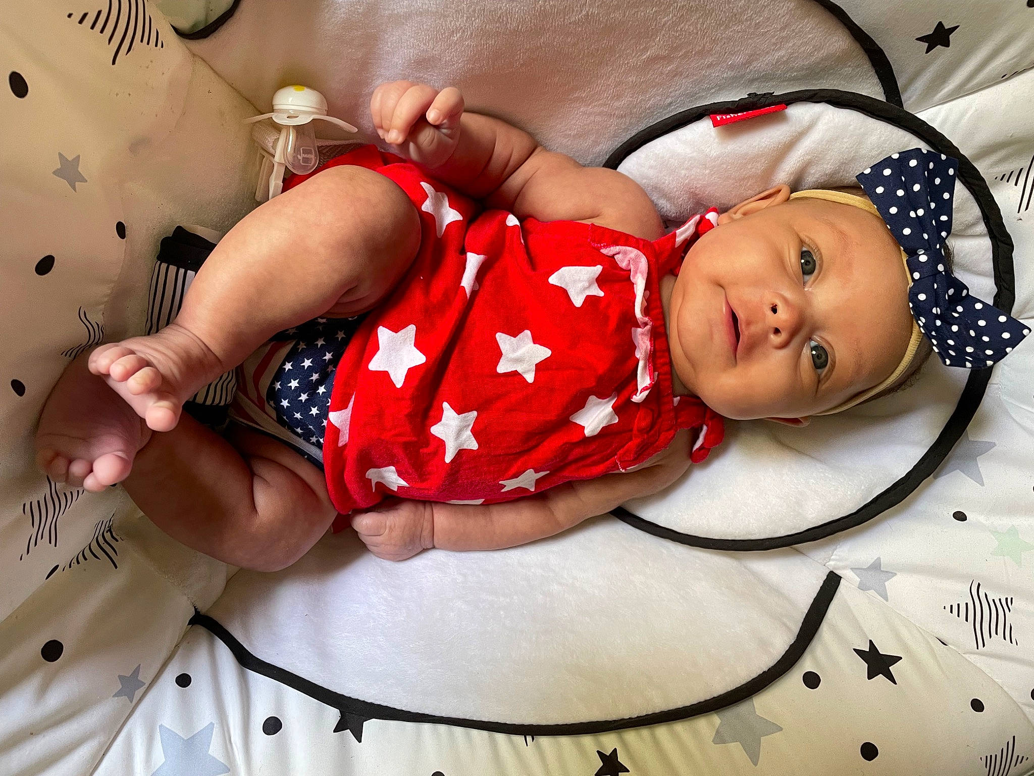 Raeleigh joined the competition — help win amazing prizes! baby, baby_sleeping, baby_toddler_clothing, carmine, child, comfort, design, fashion_accessory, finger, happy, headwear, human_leg, knee, linens, pattern, person, pink, room, textile, thigh