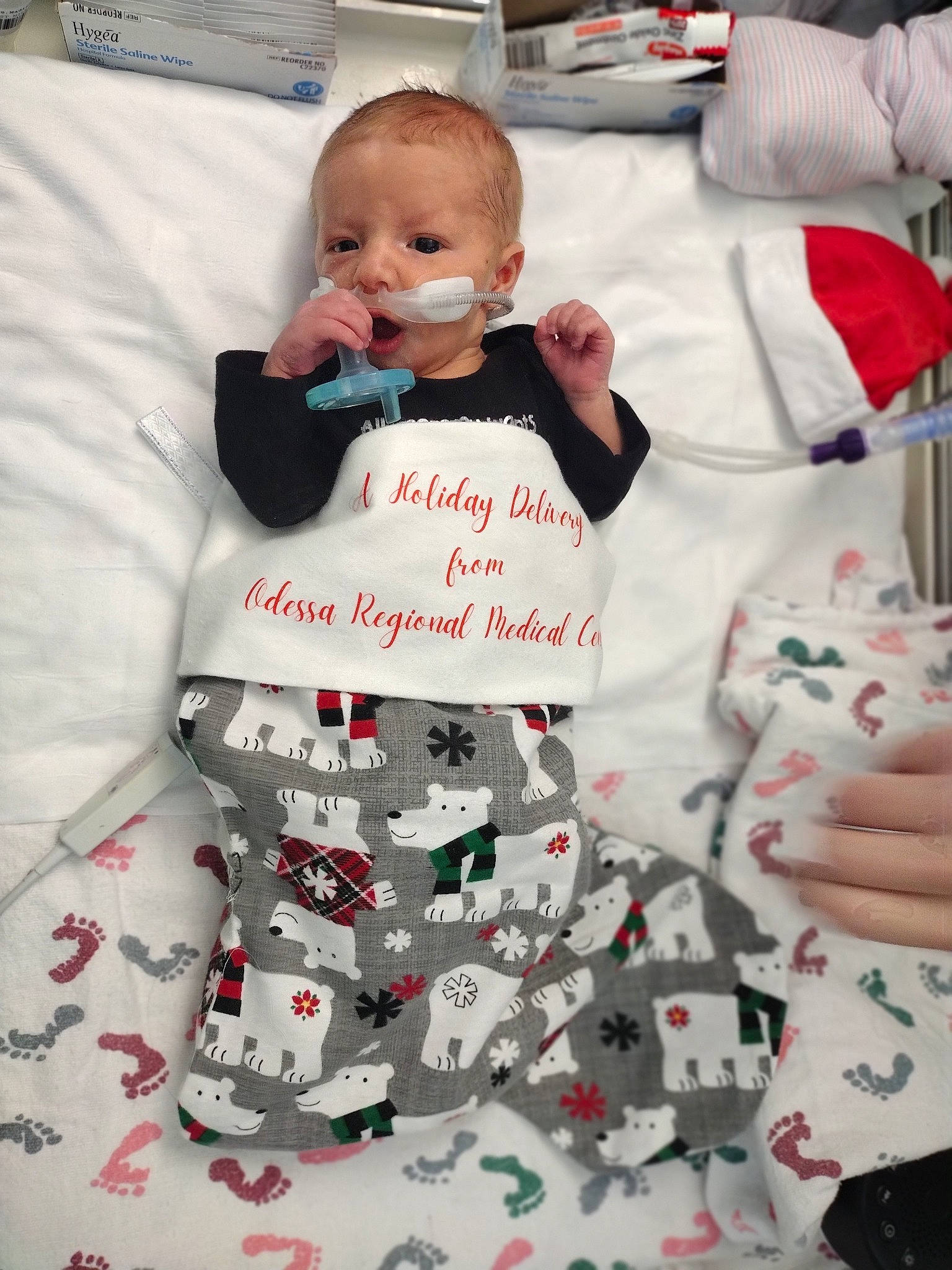 Reign is registered to the contest to win money with this photo: baby, baby_products, baby_safety, baby_toddler_clothing, carmine, child, comfort, event, font, happy, linens, pattern, person, product, red, sitting, sleeve, smile, textile, toddler