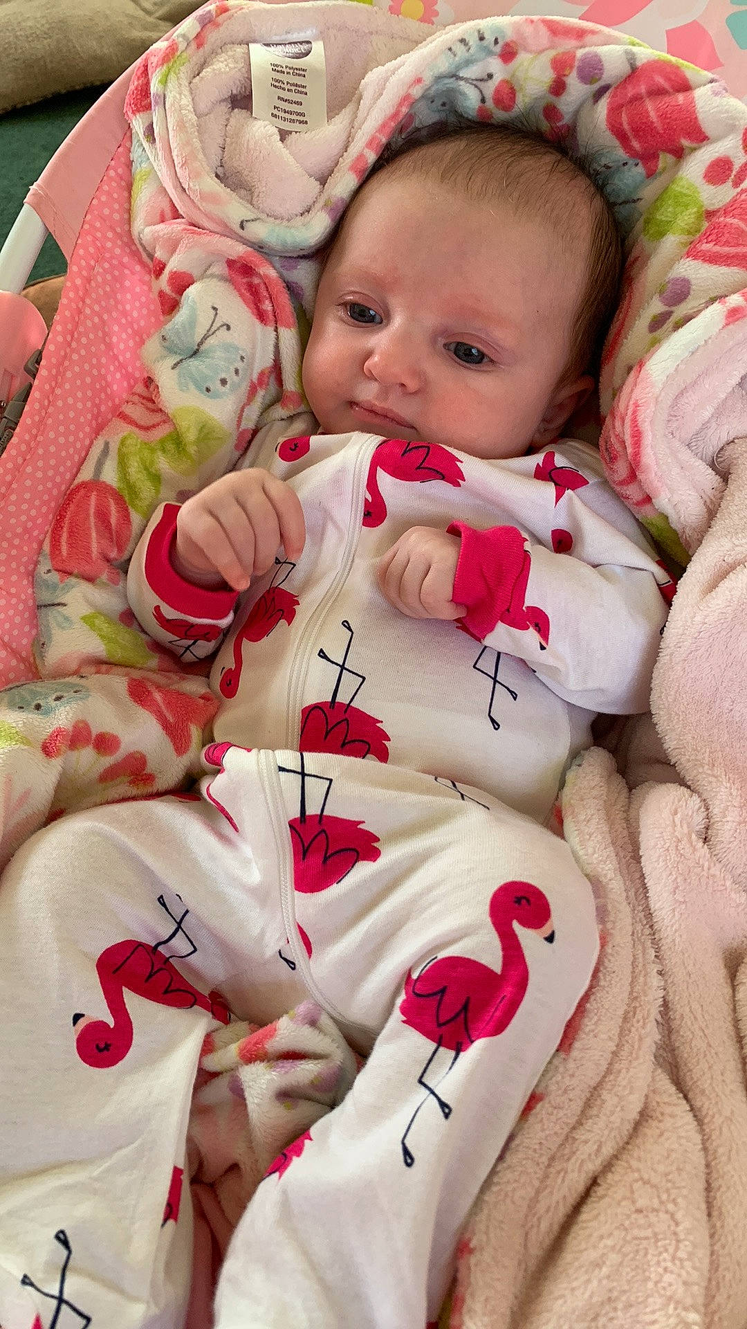 Kinslee is registered to the contest to win money with this photo: baby, baby_products, baby_sleeping, baby_toddler_clothing, cheek, child, comfort, eye, face, happy, head, linens, pattern, person, pink, red, skin, sleeve, textile, toddler