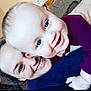 Hendrix joined the competition — help win amazing prizes! adult, baby, blue_eyes, child, close_up, couch, cozy, face, family, hand, happy, head, hug, indoor, love, person, portrait, skin, smiling, sweater