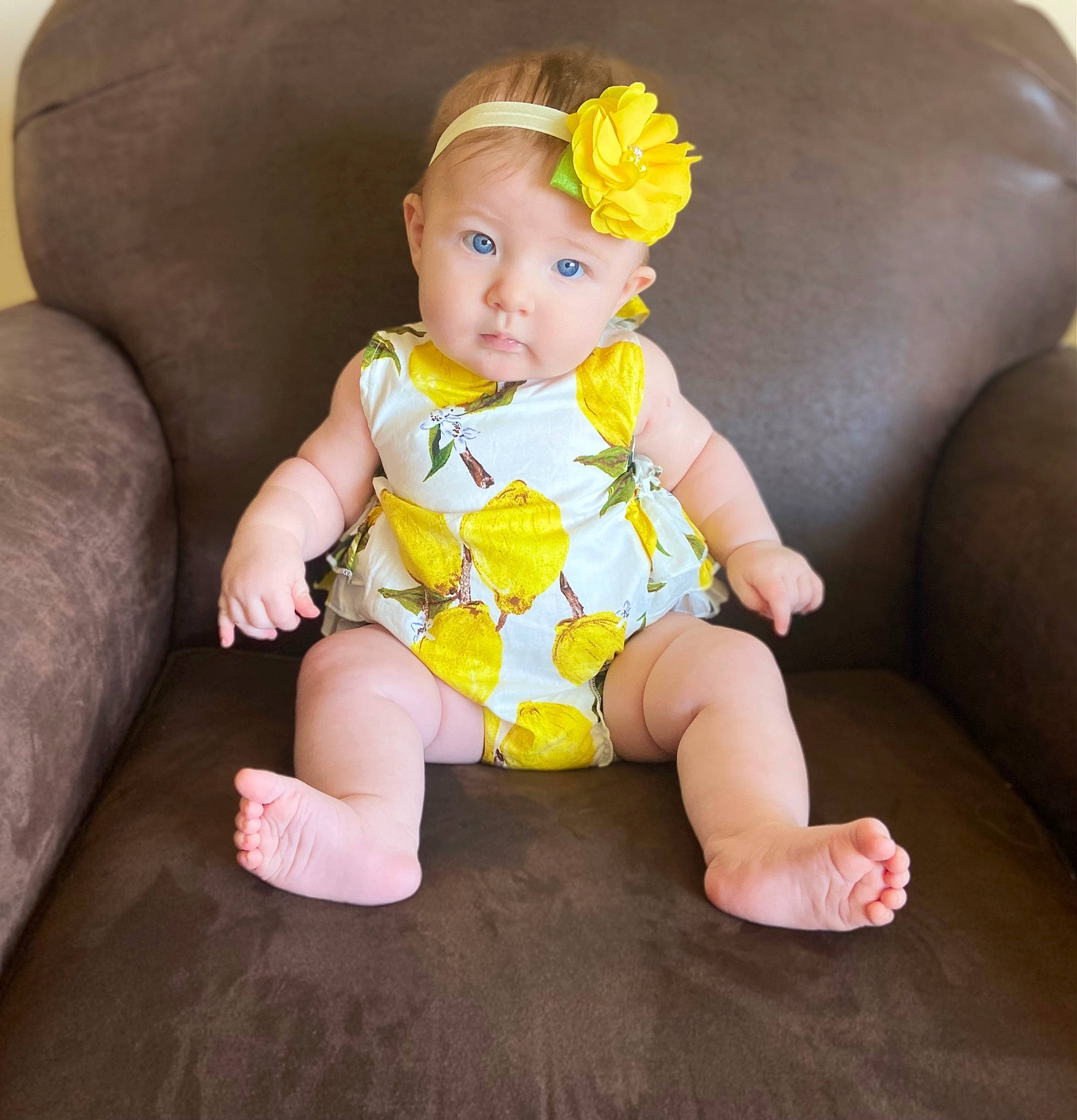 Amelia joined the competition — help win amazing prizes! baby_toddler_clothing, cheek, child, comfort, couch, eye, face, flower, head, headband, headpiece, human_leg, iris, leg, person, pink, skin, sleeve, thigh, toddler