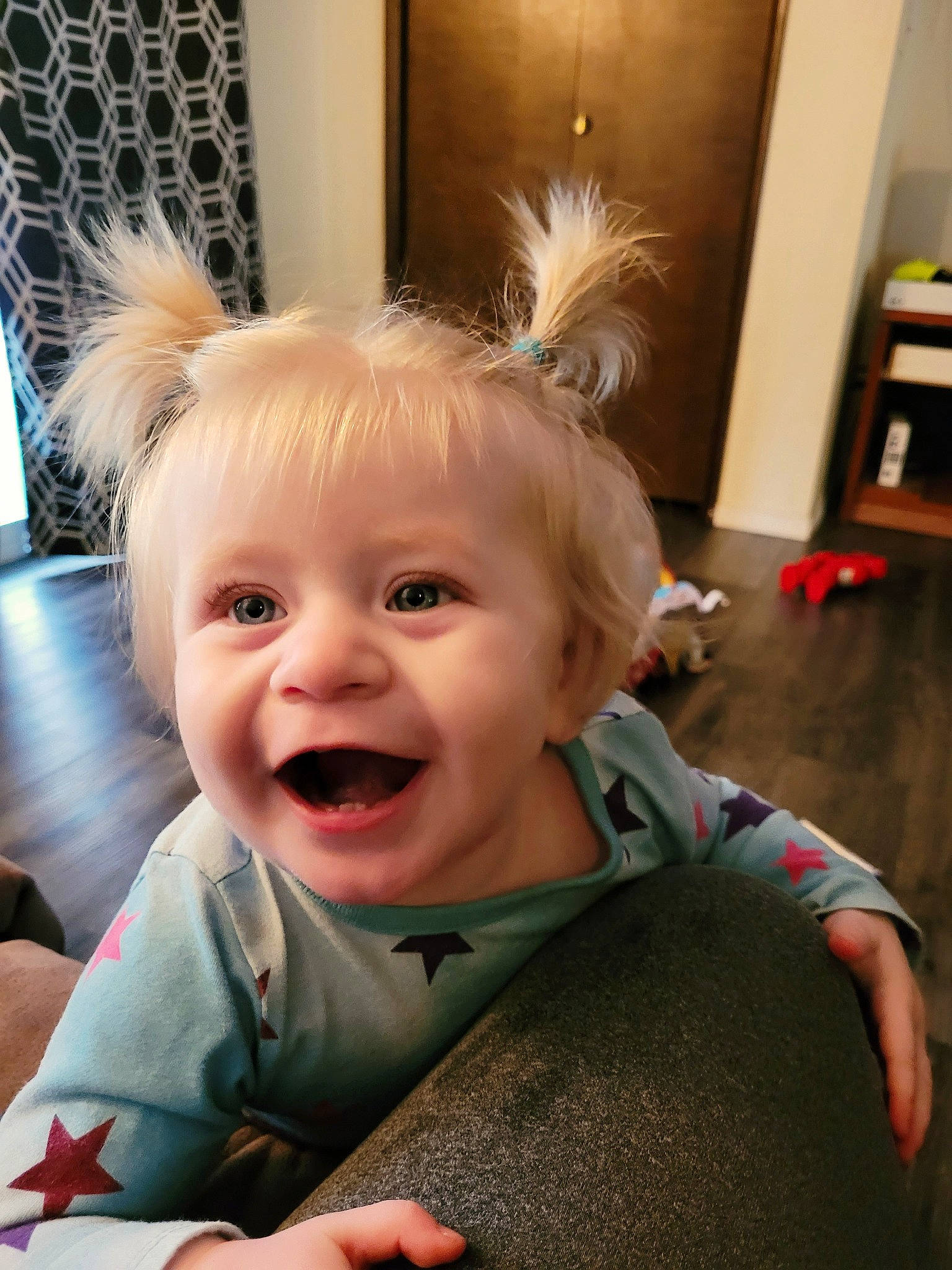 Faye is registered to the contest to win money with this photo: baby, baby_toddler_clothing, cheek, child, ear, fashion_accessory, flooring, fun, gesture, hand, happy, headpiece, iris, joy, laugh, nose, person, sitting, skin, smile