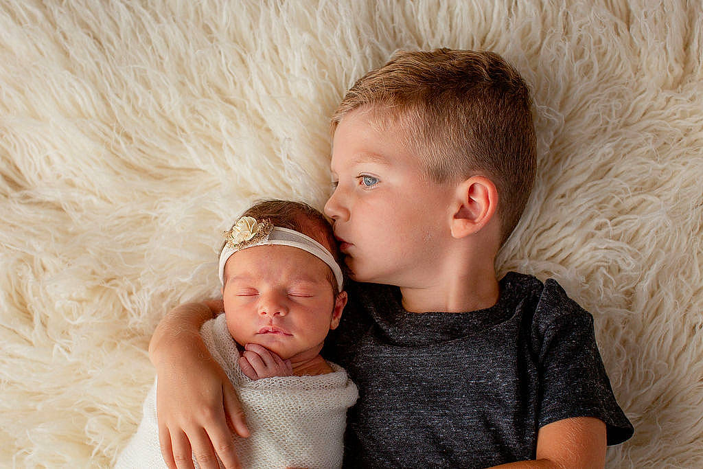 Vivian joined the competition — help win amazing prizes! arm, baby, baby_toddler_clothing, cap, child, clothing, comfort, couch, fashion_accessory, finger, gesture, hand, happy, jewellery, neck, person, sitting, skin, t_shirt, toddler