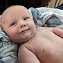 baby, infant, skin, face, eyes, expression, blanket, comfort, relaxation, soft_texture, indoors, child, cute, closeup, portrait, naked_torso, head, cheeks, young, resting