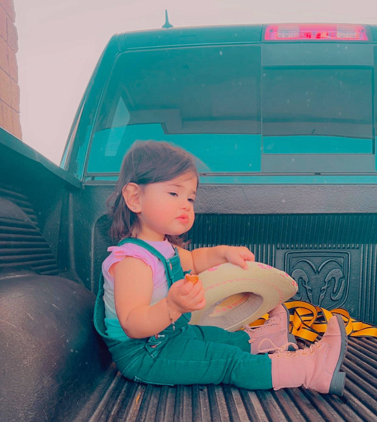 Emmarose is registered to the contest to win money with this photo: baby, child, comfort, electric_blue, fun, grass, happy, hat, human_leg, lap, leisure, person, pink, recreation, sandal, sitting, thigh, tints_and_shades, toddler, travel