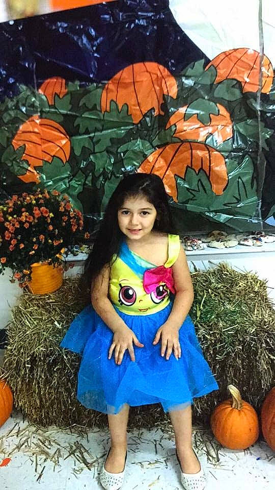 Karen is registered to the contest to win money with this photo: calabaza, child, costume, cucurbita, fruit, gourd, joy, orange, person, photomontage, plant, pumpkin, smile, toddler, winter_squash, world