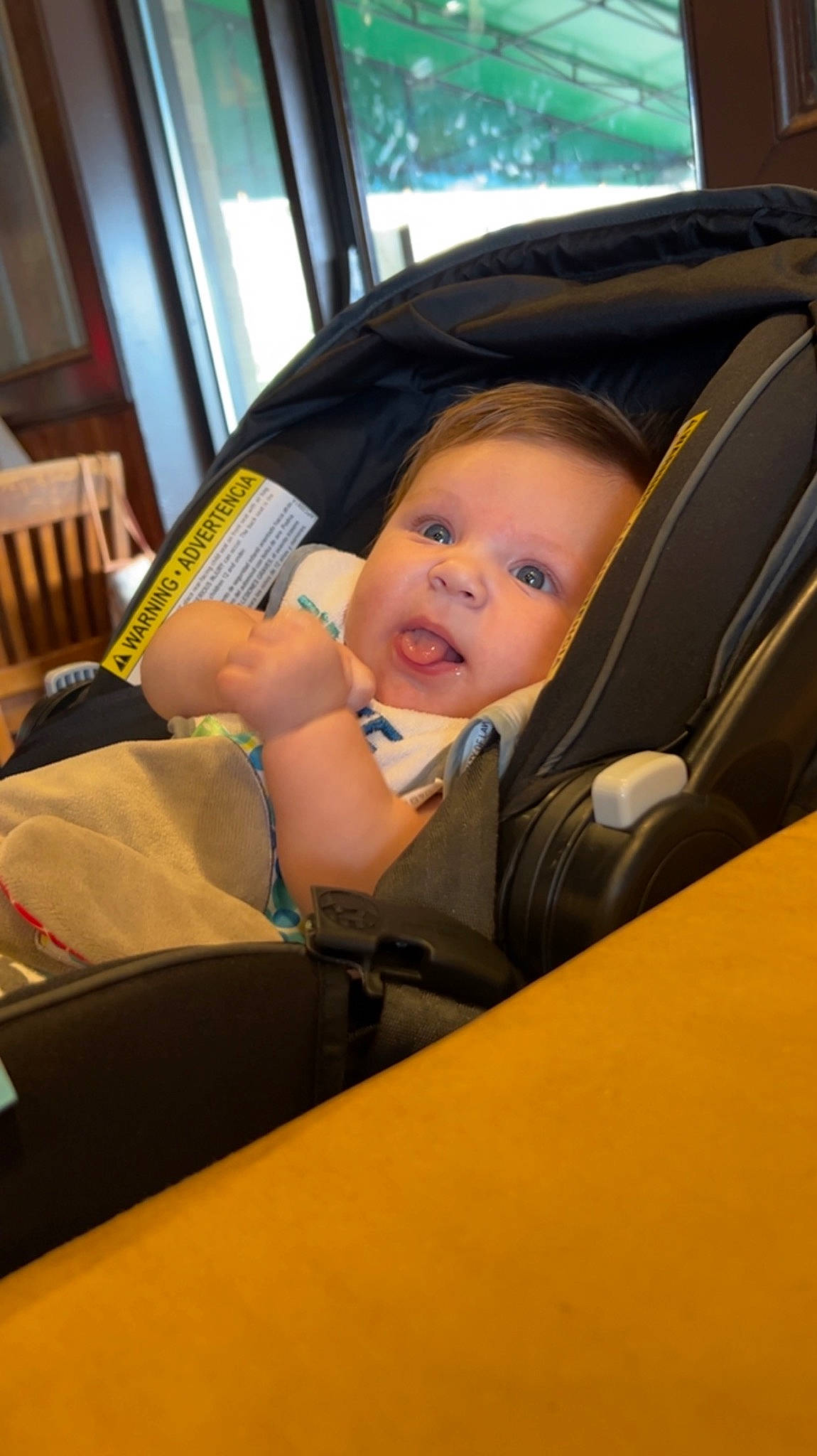 Jaxtyn is registered to the contest to win money with this photo: auto_part, automotive_design, automotive_exterior, baby, baby_carriage, baby_products, baby_toddler_clothing, car_seat, chair, child, comfort, fun, luxury_vehicle, person, sitting, smile, tints_and_shades, toddler, tree, vehicle_door