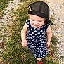toddler, child, girl, dress, heart_pattern, cap, black_cap, red_boots, outdoor, grass, gravel_path, walking, smiling, happy, nature, fall_leaves, fashion, cute, young_child, playful
