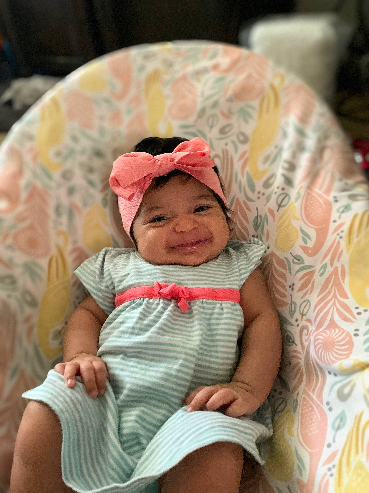 Millannii is registered to the contest to win money with this photo: baby, baby_toddler_clothing, cap, cheek, comfort, fun, happy, hat, head, headgear, headwear, human_body, joy, mouth, pattern, person, pink, sitting, skin, sleeve