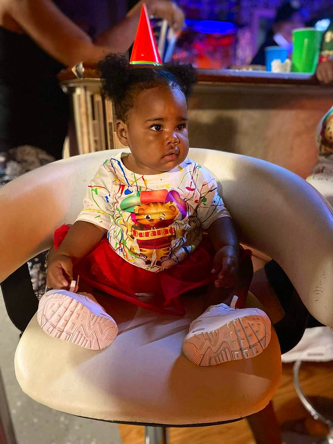 Duranae is registered to the contest to win money with this photo: chair, child, event, fashion_design, fun, furniture, happy, human_leg, lap, leisure, magenta, mammal, person, recreation, sitting, skin, snapshot, table, thigh, toddler