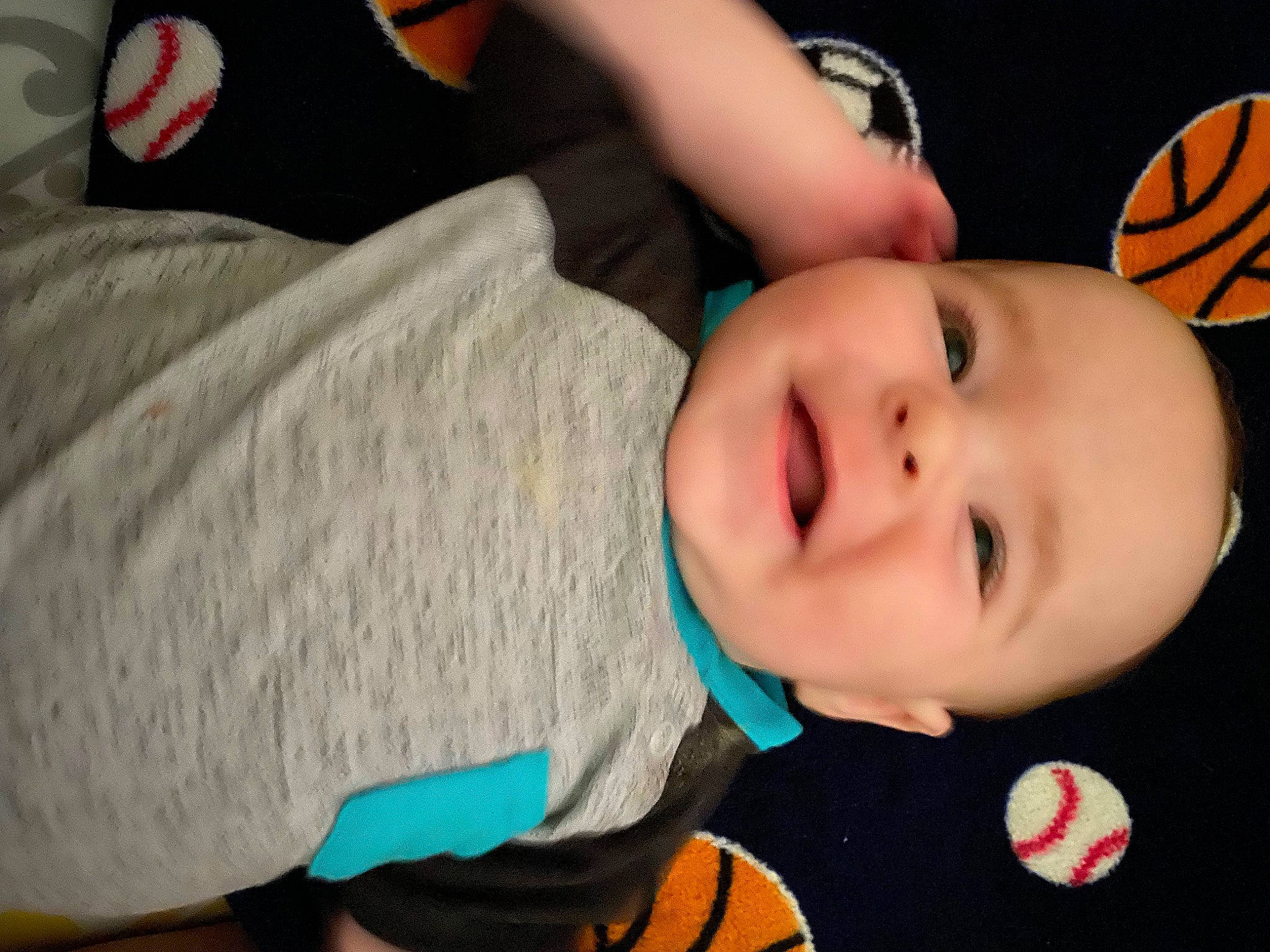 Noah is registered to the contest to win money with this photo: baby, baby_toddler_clothing, cheek, child, comfort, elbow, eye, finger, fun, happy, iris, mouth, nose, orange, person, sitting, skin, smile, t_shirt, thumb