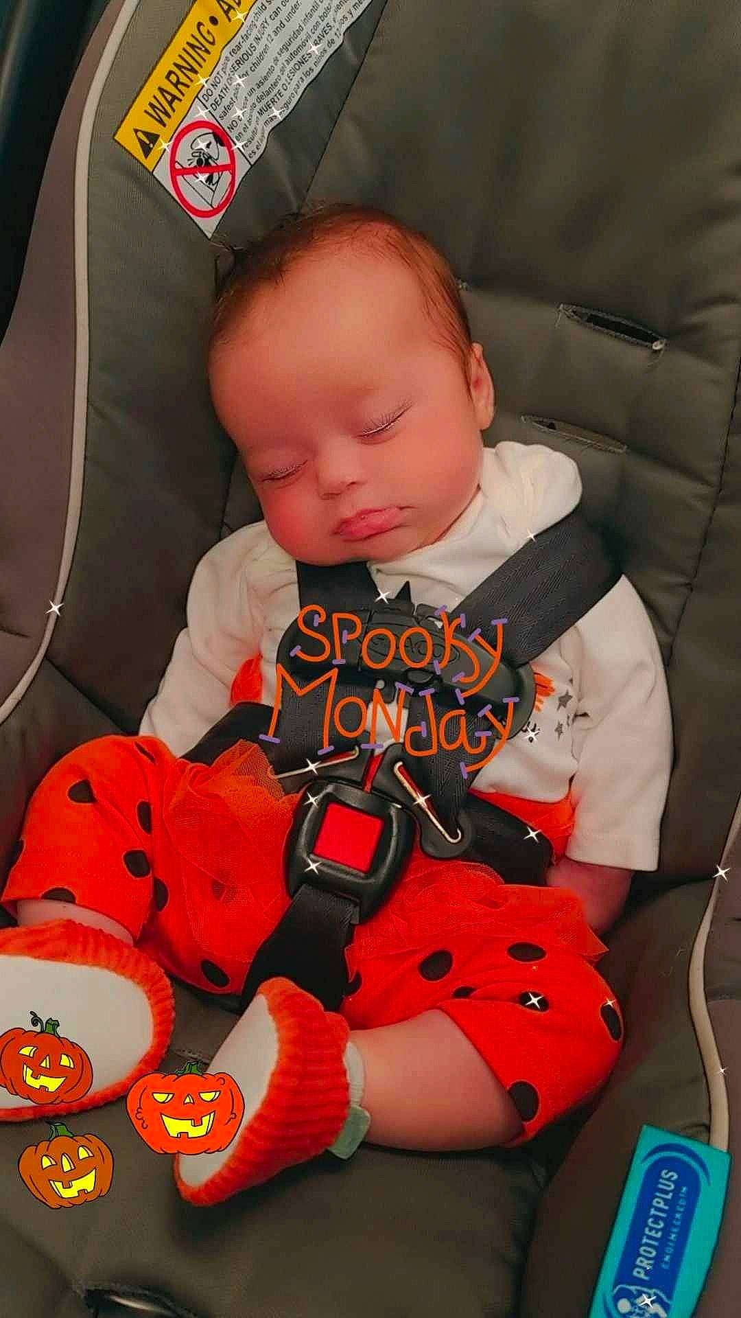 Lilyana is registered to the contest to win money with this photo: auto_part, baby, baby_carriage, baby_products, baby_toddler_clothing, car_seat, car_seat_cover, carmine, child, comfort, fun, orange, pattern, person, personal_protective_equipment, sitting, sleeve, steering_wheel, stuffed_toy, toddler