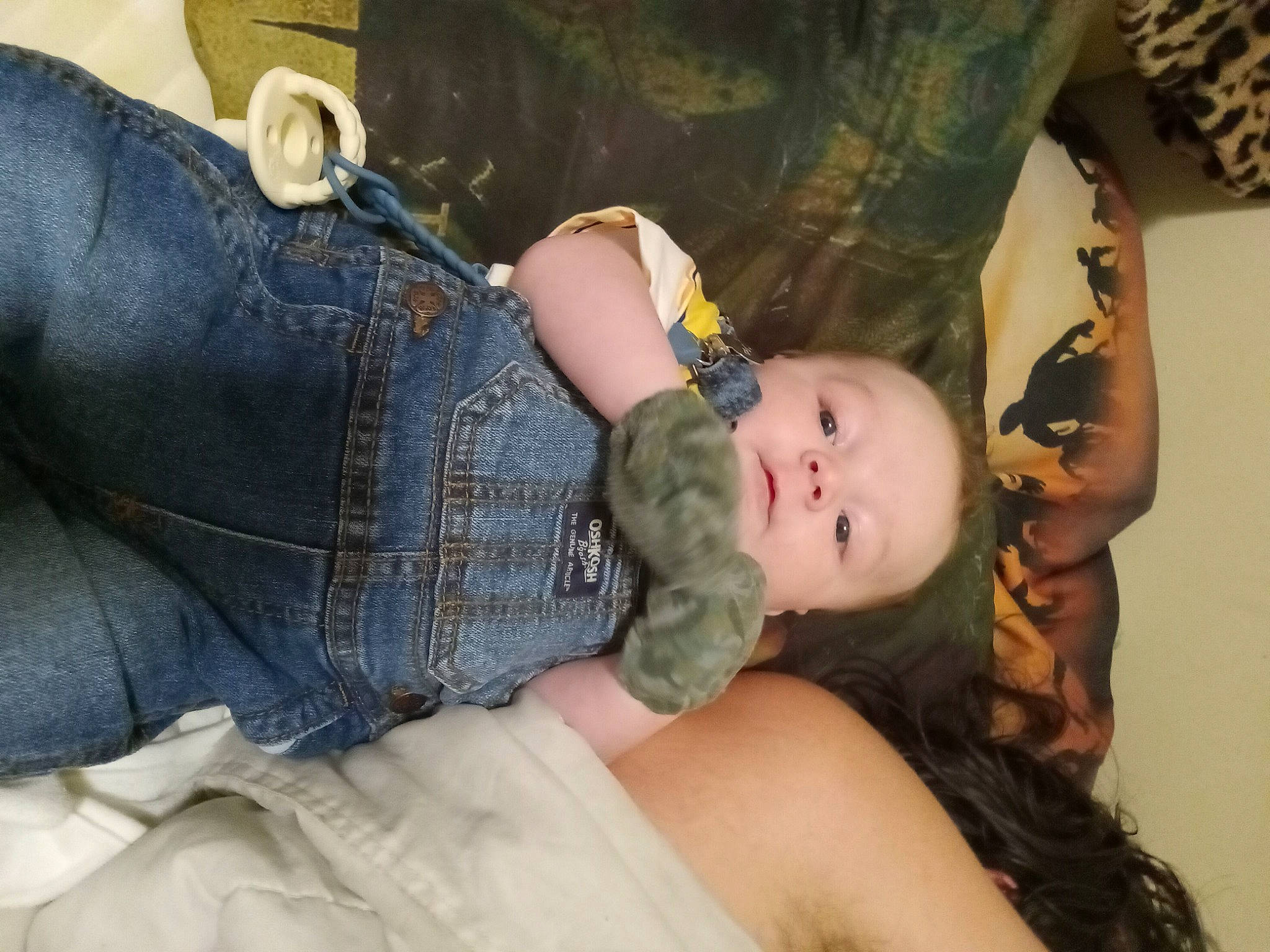 Colten is registered to the contest to win money with this photo: abdomen, arm, baby, baby_toddler_clothing, cheek, child, comfort, couch, denim, eye, finger, fun, gesture, human_body, jeans, person, sitting, skin, thigh, toddler