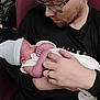 newborn, baby, man, glasses, holding, love, affection, indoor, portrait, hat, blanket, seated, beard, closeup, family, parent, child, tender, gentle, care