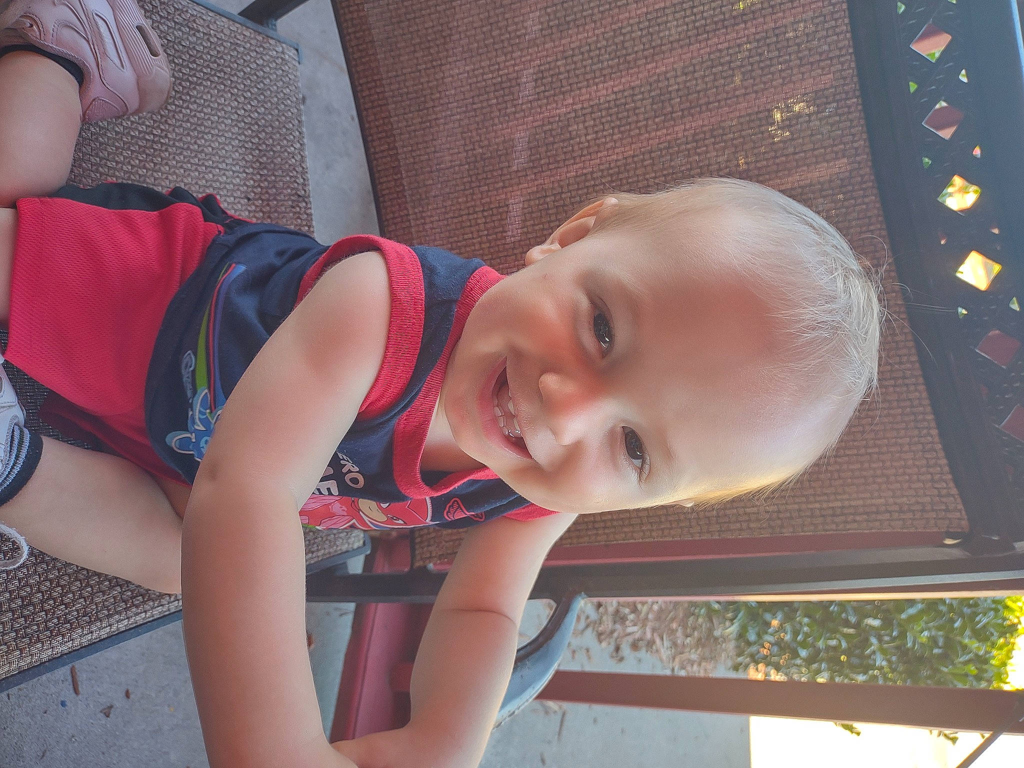 Nathan is registered to the contest to win money with this photo: baby, baby_products, child, facial_expression, fun, happy, human_leg, joy, leisure, luggage_and_bags, mouth, pattern, people, person, photograph, play, sitting, smile, thigh, toddler