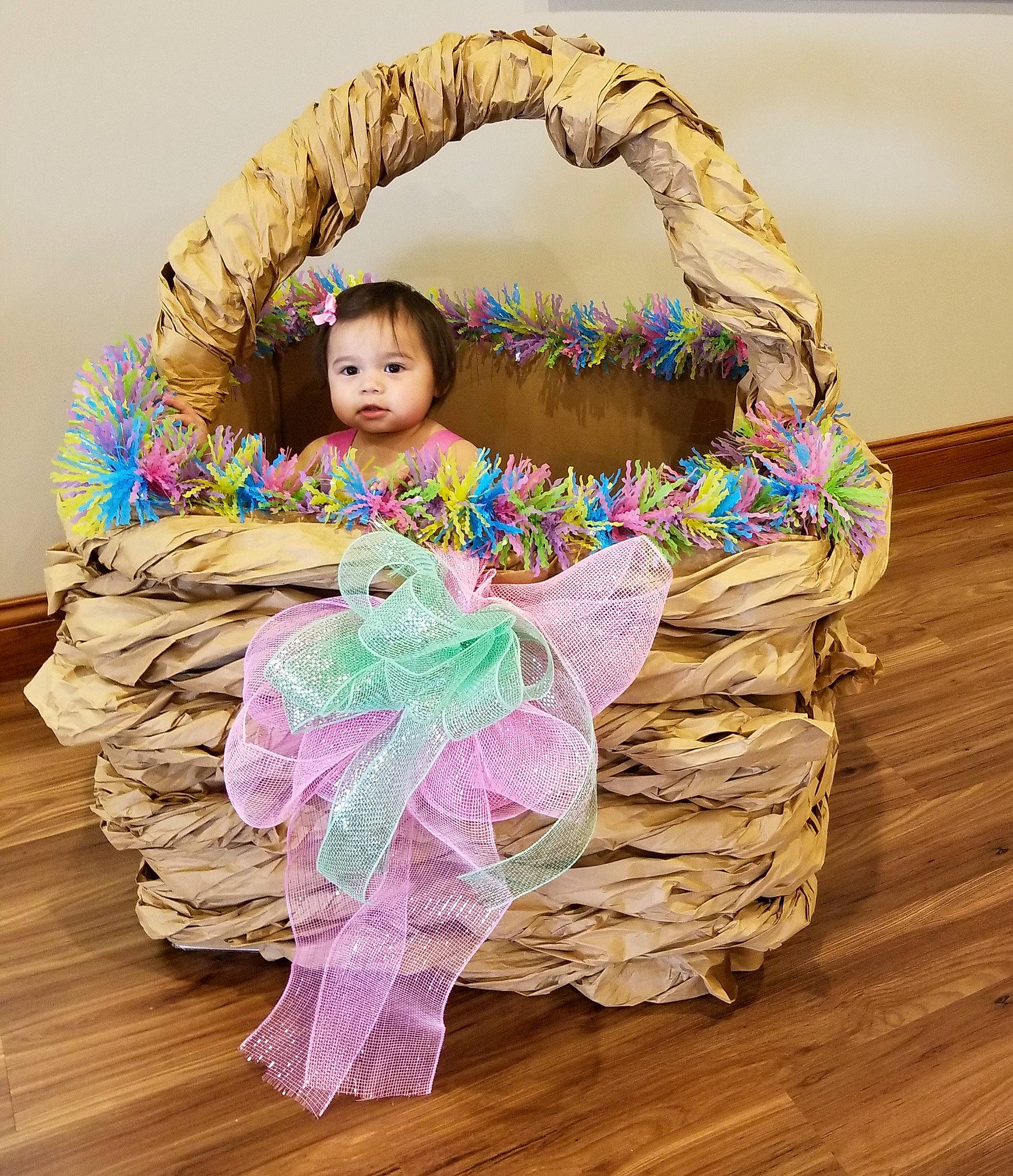 Isabella joined the competition — help win amazing prizes! baby, baby_products, baby_toddler_clothing, bag, comfort, event, fashion_accessory, happy, hardwood, headpiece, linens, magenta, outerwear, pattern, person, pink, sitting, sleeve, textile, toddler