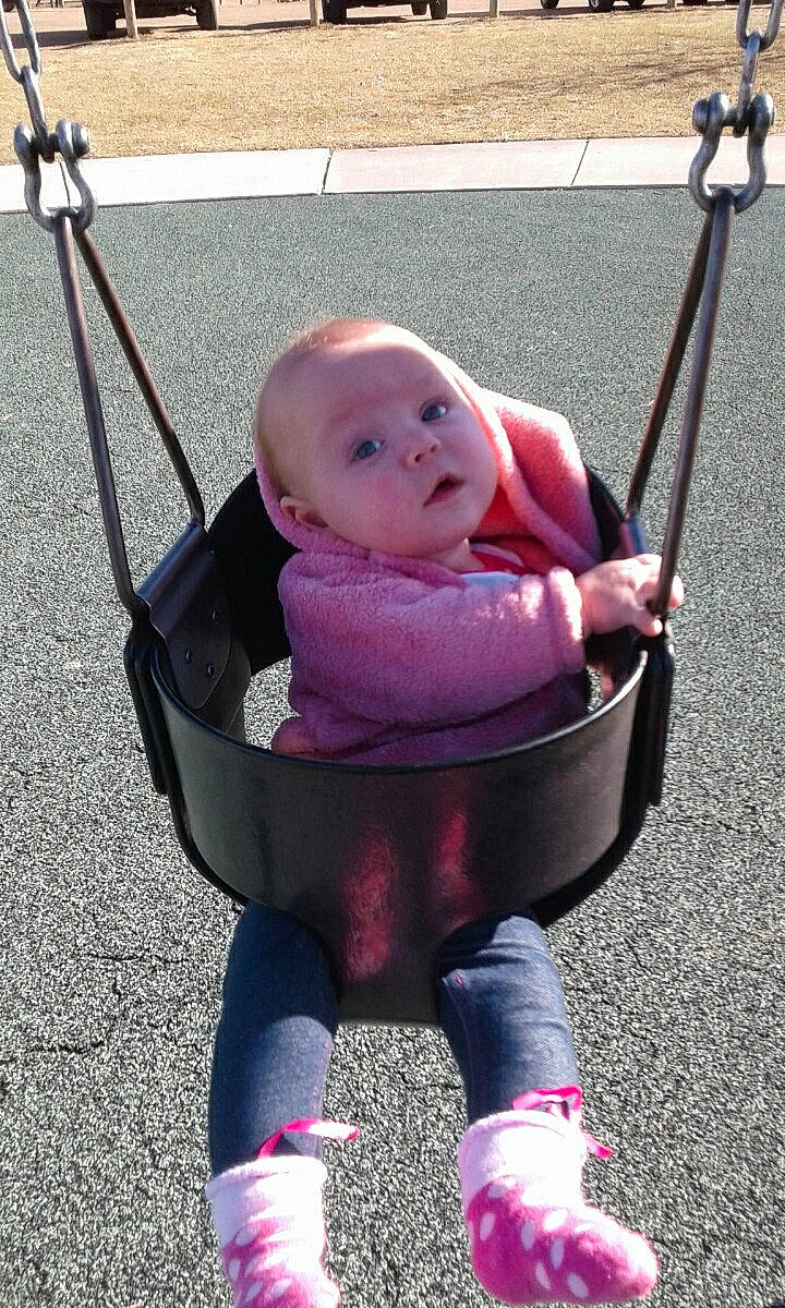 Megan joined the competition — help win amazing prizes! baby_carriage, baby_products, child, fun, girl, infant, magenta, outdoor_play_equipment, person, pink, play, product, purple, sitting, smile, swing, toddler, vacation, vehicle