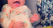 Harper joined the competition — help win amazing prizes! apparel, baby, blanket, child, comfort, cozy, cushion, cute, face, floral_pattern, happy, indoor, infant, onesie, person, pillow, sitting, smiling, soft_toys, young