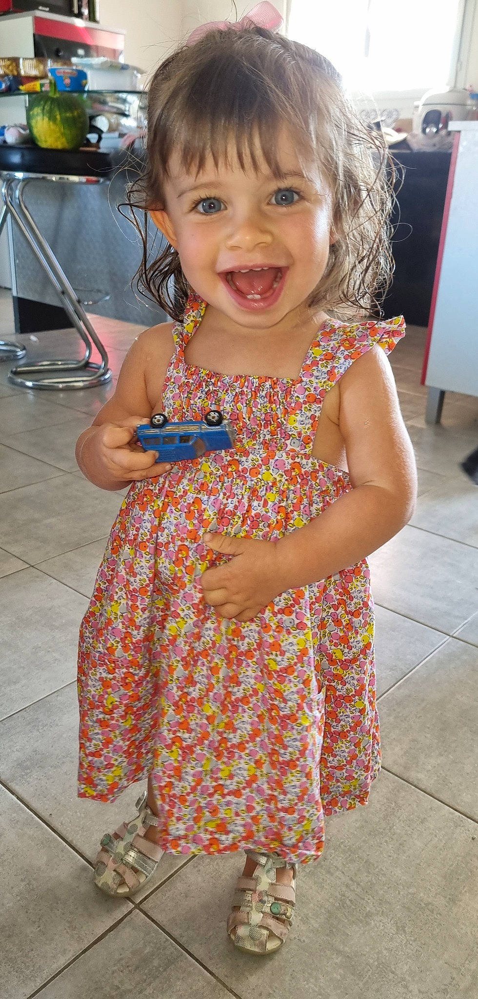 Mya participe au concours pour gagner de l'argent avec cette photo : day_dress, dress, facial_expression, fun, hair, hairstyle, happy, head, iris, joint, one_piece_garment, organ, person, photograph, pink, skin, smile, standing, summer, toddler