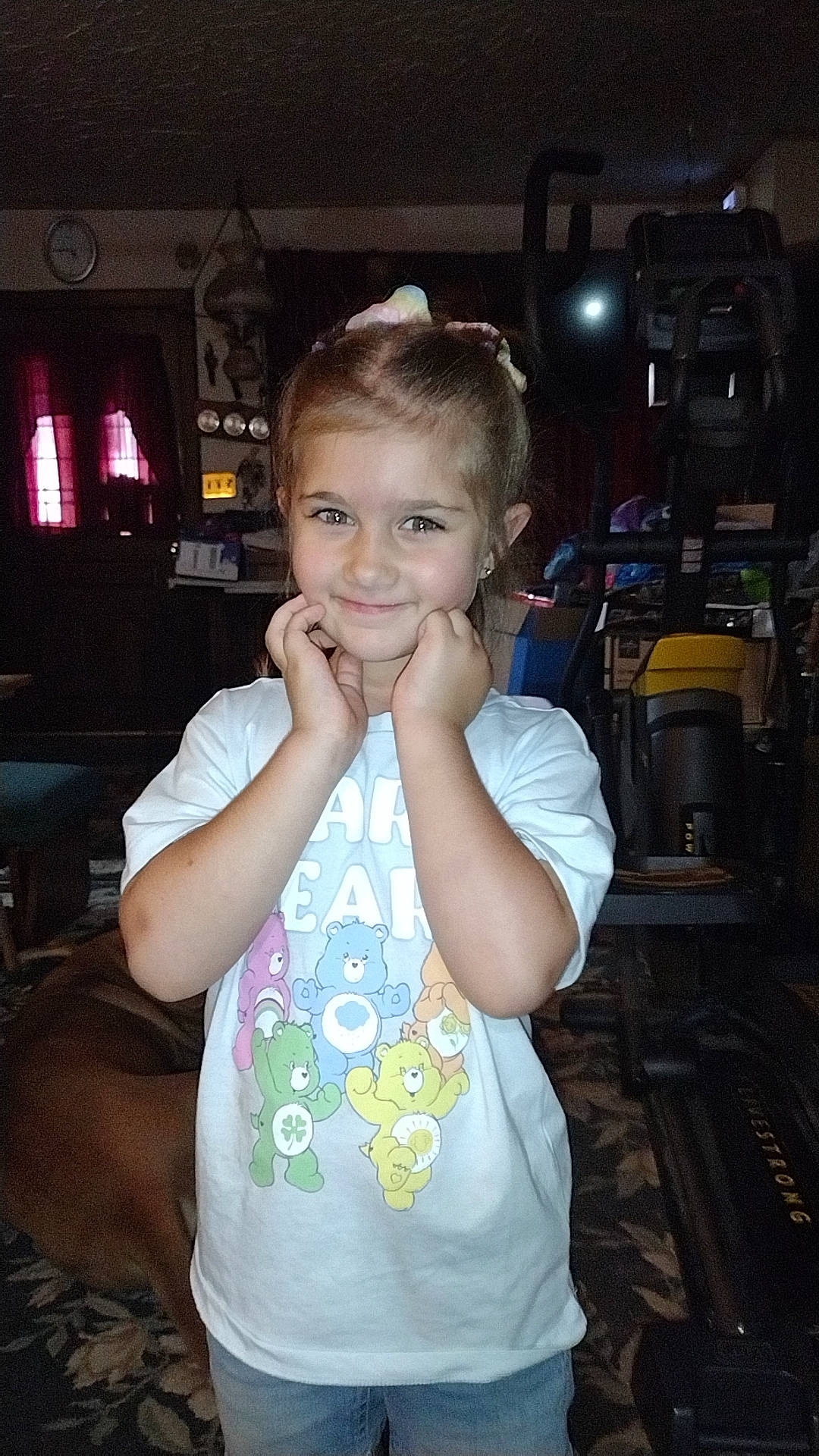 Sutton is registered to the contest to win money with this photo: cheek, child, ear, eye, flash_photography, fun, gesture, hairstyle, happy, iris, joy, leisure, night, person, picture_frame, room, sitting, smile, standing, t_shirt