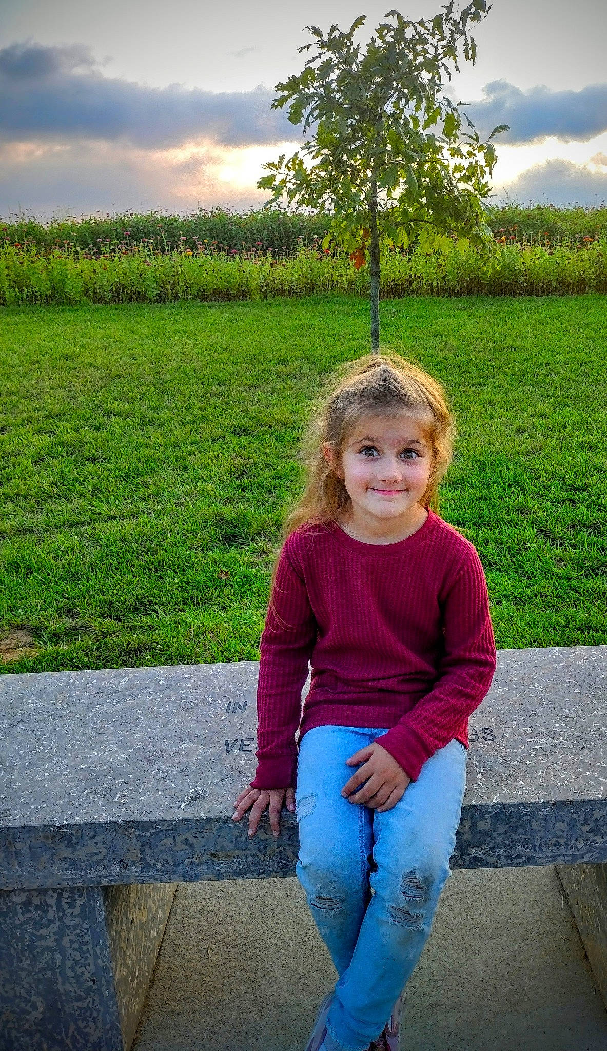 Sutton is registered to the contest to win money with this photo: cloud, denim, electric_blue, fun, grass, grassland, hairstyle, happy, jeans, joy, leisure, people, people_in_nature, person, photograph, plant, sky, smile, standing, summer