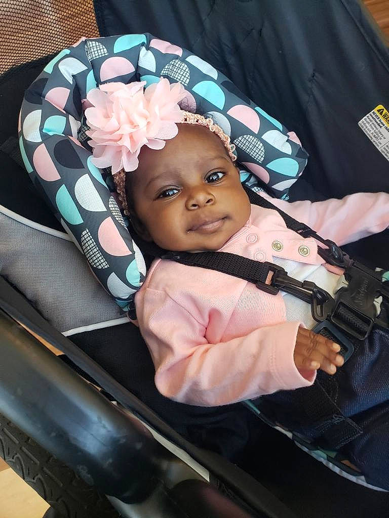 Yaminah joined the competition — help win amazing prizes! auto_part, baby, baby_carriage, baby_products, baby_safety, baby_toddler_clothing, bag, car_seat, chair, cheek, child, comfort, fashion_accessory, headwear, infant_bed, outerwear, pattern, person, rose, seat_belt
