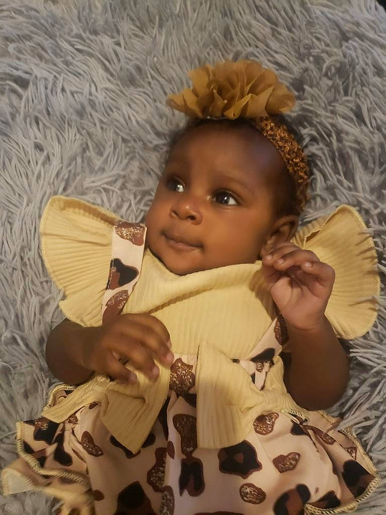 Yaminah joined the competition — help win amazing prizes! baby, baby_products, baby_toddler_clothing, cheek, child, comfort, eye, finger, happy, linens, lip, nose, person, sitting, skin, sleeve, textile, thumb, toddler, vintage_clothing
