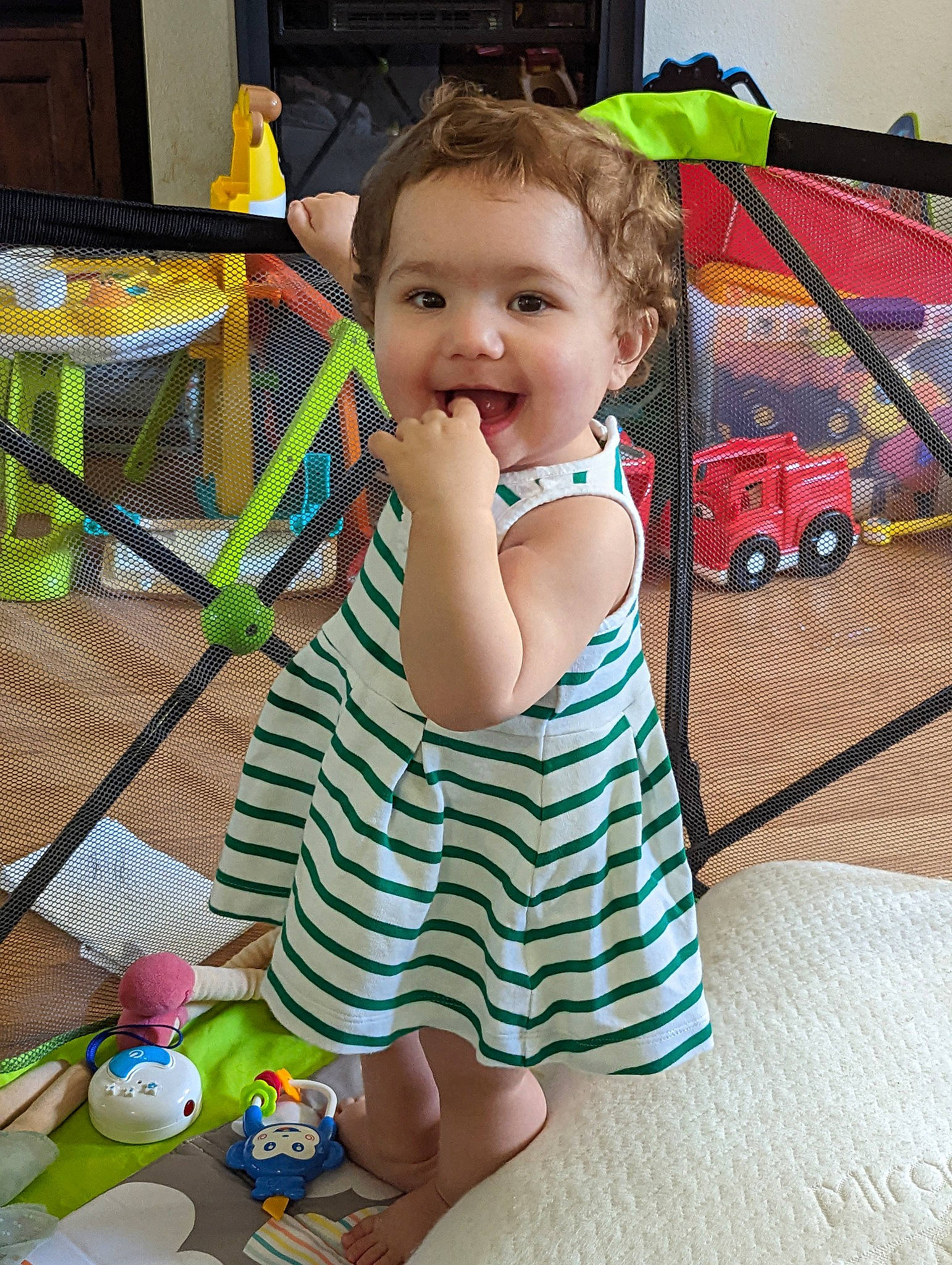 Piper is registered to the contest to win money with this photo: baby, baby_toddler_clothing, child, dress, flooring, fun, happy, leisure, pattern, person, play, product, sitting, skin, smile, summer, tire, toddler, toy, vacation