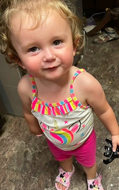 Zoey is registered to the contest to win money with this photo: baby_toddler_clothing, cheek, chin, dress, eye, face, facial_expression, hair, hairstyle, happy, head, iris, lip, mouth, nose, organ, person, pink, skin, smile